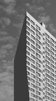Framed Print : Black and White Skyscraper on the Cloudy Sky Background Framed Print : Black and White Skyscraper on the Cloudy Sky Background