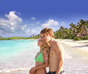 Blond couple of young tourists in a tropical summer beach palms trees in Mexico photo mount
