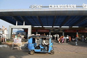 Blue auto rickshaw stand in front of Chandigarh railway station built in 1954, India Union Territory