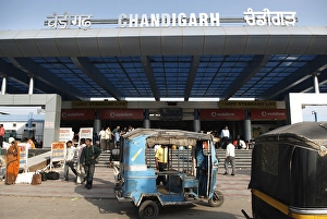 Blue auto rickshaw stand in front of Chandigarh railway station built in 1954, India Union Territory