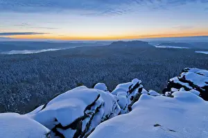Blue hour after sunset on the Gohrisch table mountain with a view of the Pfaffenstein