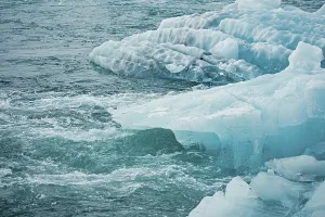 Blue icebergs floating in a cold