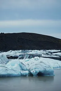 Blue icebergs against a horizon