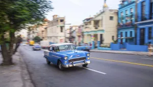 Blue oldtimer in Cubas capital with blurred background