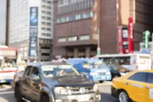 Blurred abstract people and car moved at city center at Taipei