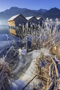 Boat huts, icy shore, lake, morning light