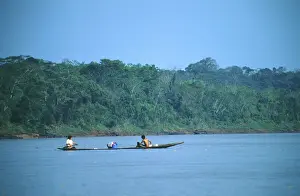 Boat traffic on the Rio Tambopata near Puerto Maldonado in the Amazon Basin