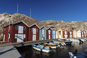 Boats and colourful boathouses in the harbour of Smoegen