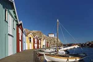 Boats and colourful boathouses in the harbour of Smoegen