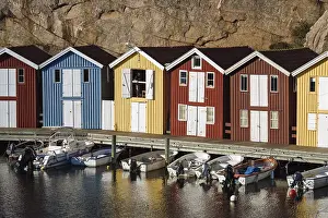 Boats and colourful boathouses in the harbour of Smoegen
