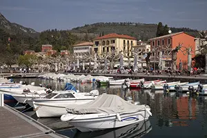 Boats moored in the harbour, promenade with Villa Albertini