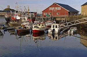 Boats and their reflections in the harbor of Sto