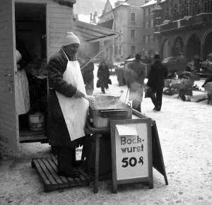 Bockwurst salesman in winter on a street in Freiburg