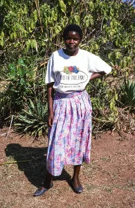 Full body portrait of a standing young woman with Fruit of the Look T Shirt, Malawi, Southern Africa, 1995, Africa