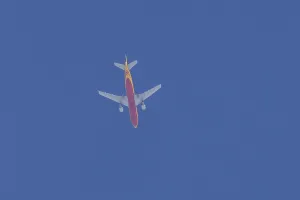 Boeing 767 jet aircraft of DHL cargo airlines in flight in a blue sky