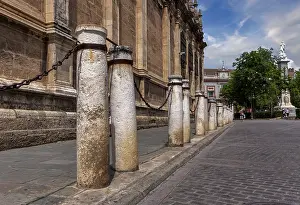 Bollards on the pavement, architecture in the old town