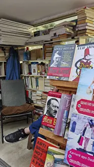 Bookshelves in an outdoor bookstore with various books