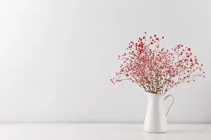 Framed Print : Bouquet of pink gypsophila or baby's-breath flowers in a pitcher on white table