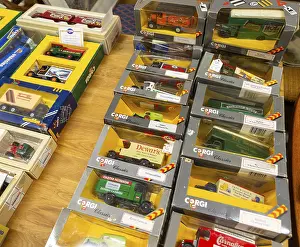 Boxes of Corgi model trucks, vans and other vehicles on display at auction