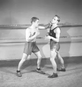 Boxing in the old days. Two young boxers facing each other