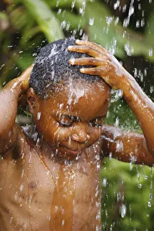 Boy, 6 years, under a shower, Bamenda