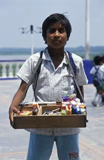 Boy with belly shop selling sweets in Iquitos