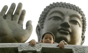 Category Buddhism Prints: Boy in front of a bronze Buddha at Po Lin Monastery