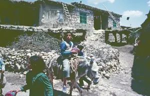 Boy, girl, children, donkey with sack, Kurdish village Karadut, south-east Anatolia, Turkey, May 1987, vintage, retro, old, historical, Asia