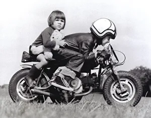 Boy and girl riding a motorcycle