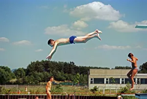 Boy jumping from three-metre board