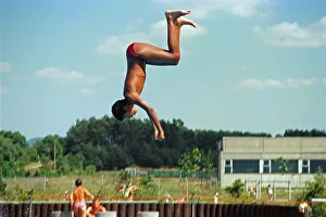 Boy jumping from three-metre board