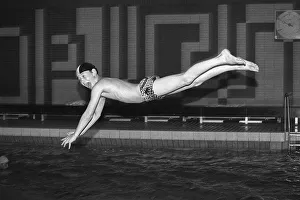 Boy jumps from three-metre board