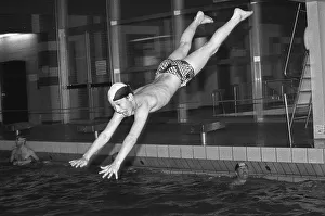 Boy jumps from three-metre board