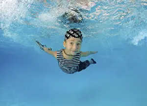 Boy presenting underwater fashion in pool
