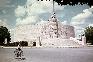 Boy riding a bicycle at the Monumento a la Patria, Monument to the Homeland, Paseo de Montejo, Merida, Yucatan, Mexico, around 1961, created by Romulo Rozo, Central America