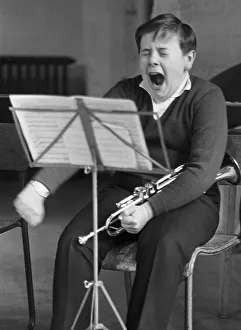 Boy yawns, trumpet, England, Great Britain