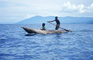 Two boys in a dugout on Lake Malawi