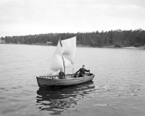 Two boys in a home-made sailboat in 1950