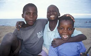 Three boys posing for camera, Chitimba