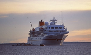 Brazil: Hapag Lloyd cruise ship Bremen at sunset on the Amazon River near Manaus