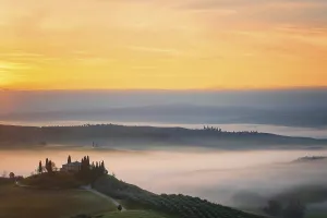 A breathtaking sunrise over the rolling hills of Val d Orcia