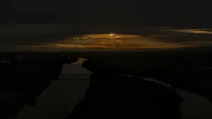 A breathtaking sunset colours the sky in golden and orange tones