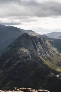 Breathtaking view of Norway's rugged mountains under cloudy skies Perfect for outdoor enthusiasts