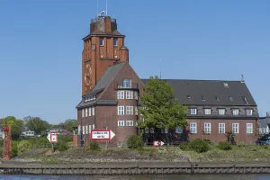 Brick building with clock tower on the waterfront