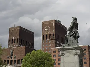 Brick building with tower and statue