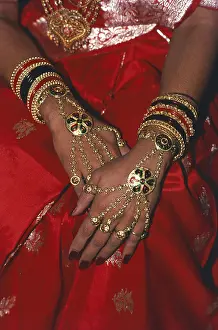Bride showing jewelleries and ornaments on hands