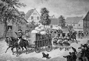 The bride's beds are driven through the village by a wagon
