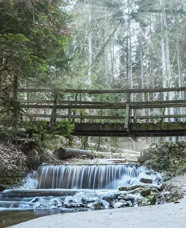 Bridge over a fairy tale waterfall