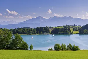 A bright blue lake with sailing boats