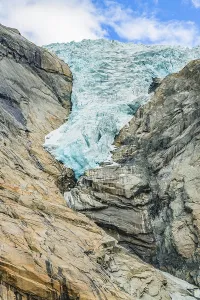 Briksdal or Briksdalsbreen glacier with melting blue ice